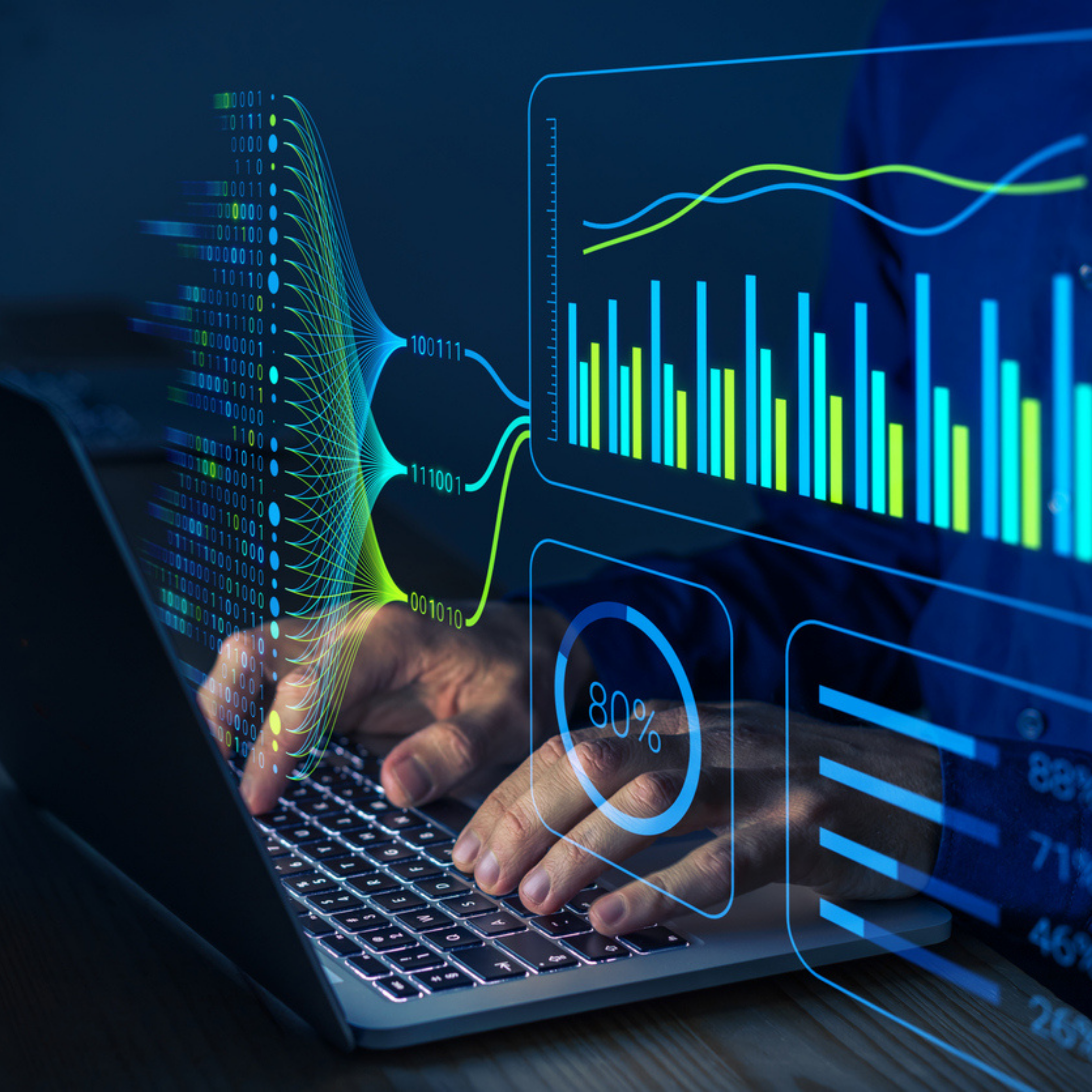 A stock image of someone typing on a laptop with graphs placed over the image