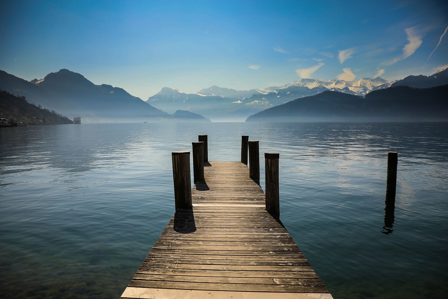 A dock parting calm water.